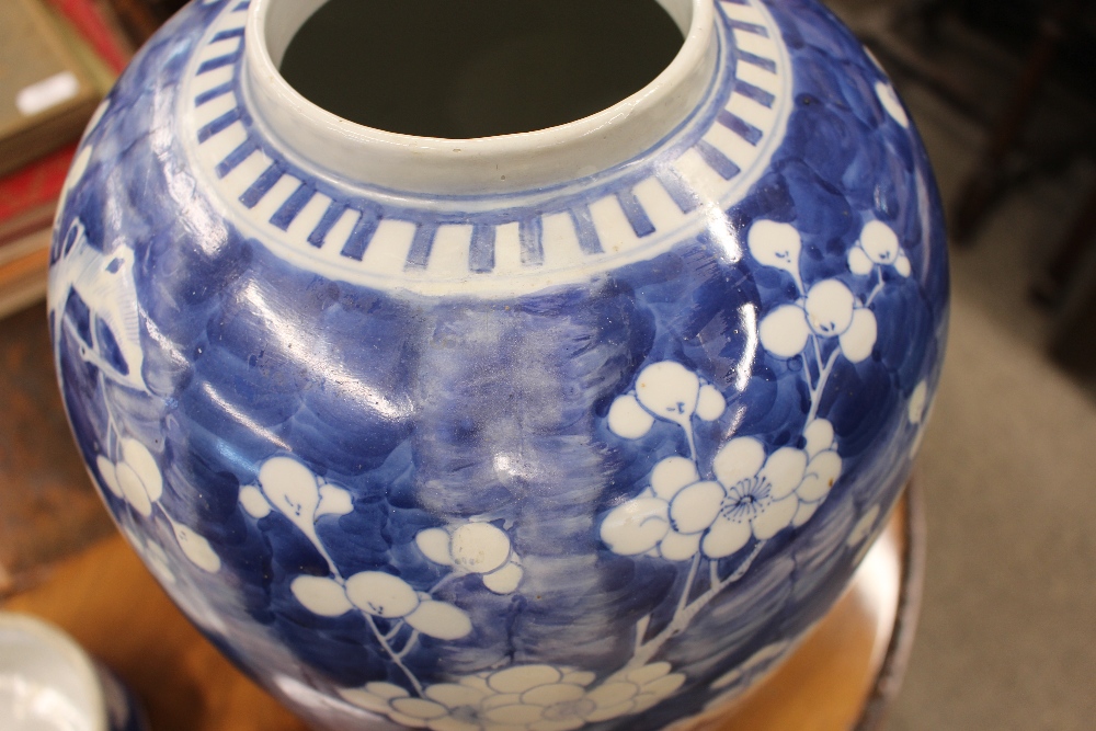 A large Chinese blue and white vase and cover, with Prunus decoration, restored, the lid  AF, 44cm - Image 6 of 8