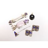 A silver pendant set with semi-precious stone; a silver, gold and amethyst set brooch; an enamel