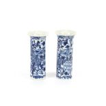 Two Chinese cylindrical blue and white vases, having dragon and foliate decoration, four character