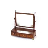 A 19th Century mahogany and boxwood strung bow fronted dressing table mirror, the rectangular