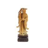 An antique Chinese soapstone figure, of an immortal, 21cm high