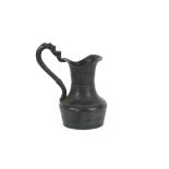 A 19th Century copper jug, of baluster form with scroll handle, 25cm high