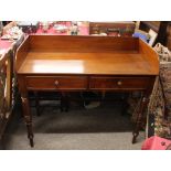 A 19th Century mahogany tray top wash stand, fitted with two drawers and raised on ring turned
