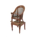 A 19th Century mahogany bergere type child's high chair, raised on a square stand terminating in