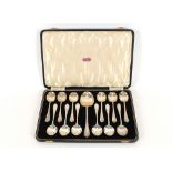 A cased set of 12 silver fruit spoons, and a serving spoon, Sheffield 1936