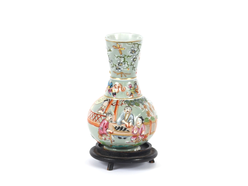 A Chinese baluster vase, with raised decoration of figures, flowers, butterflies and fish on celedon