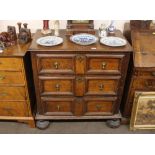 An Antique oak chest, fitted three long moulded panelled drawers, having brass acorn drop handles