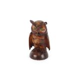 A 19th Century carved softwood Black Forest inkwell, in the form of an eagle owl with hinged lid and