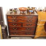 A Georgian mahogany secretaire chest, having fitted writing drawer above two short and two long