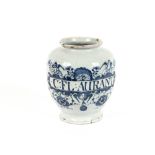 An English Delft dry drug jar, C:FL;AURANT, of baluster form, decorated blue floral scrolls and