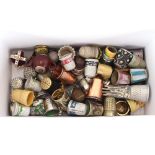 A miscellaneous collection of various metalware thimbles, including commemorative examples,