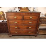 A George III mahogany and satin wood strung chest, fitted two short and three long drawers, raised