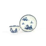 A miniature Worcester blue and white tea bowl and saucer, decorated pagoda and rural scenes,