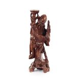 A Chinese carved hardwood figure, of an immortal 36cm high