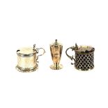 A William IV silver drum shaped mustard pot, with foliate engraved decoration, the hinged lid with