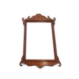 A Chippendale style walnut fret carved wall mirror, 71cm x 37cm