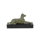 An Art Deco bronze study of a recumbent dog, signed Ouline, 50cm long