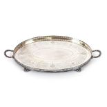 A plated oval gallery two handled drinks tray, having foliate engraved decoration, raised on ball