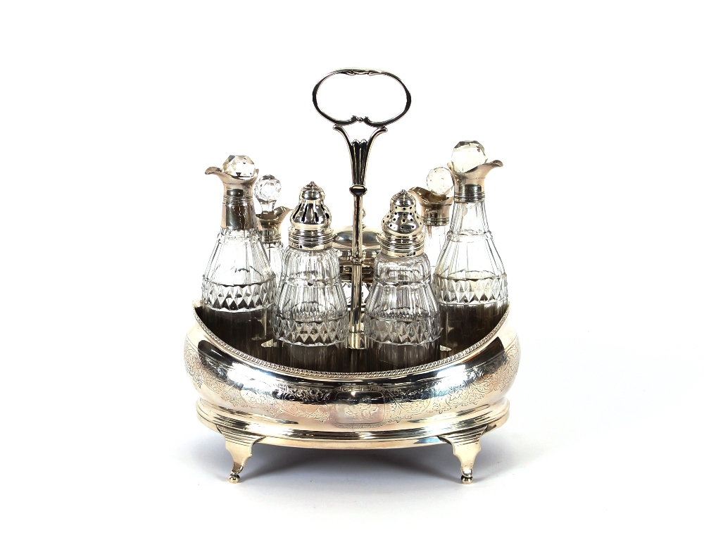 A George IV silver cruet, containing various bottles, some AF, London 1826