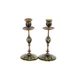 A pair of 19th Century Austrian jewelled and enamelled gilt metal candlesticks, 21cm high
