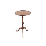 A circular mahogany occasional table, the dished top raised on turned baluster column and tripod