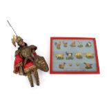 An antique puppet in the form of a knight in armour; together with a collage of 1930's coloured