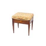 An Edwardian inlaid mahogany piano stool, having upholstered lifting seat, raised on square tapering