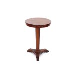 A Victorian circular rosewood pedestal table, raised on tapering octagonal column and triform