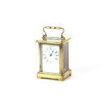 A French brass cased carriage clock, having Roman numeral dial, 12cm high