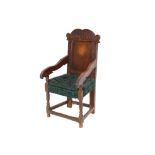 An Antique oak Wainscot chair, having leaf carved scrolled cresting rail, geometric decorated