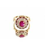 A large ruby and diamond cluster ring, the mount stamped 750