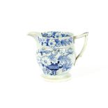 A 19th Century blue and white baluster jug, decorated with urns and foliate sprays, castellated rim,