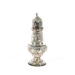 An Edwardian silver baluster sugar shaker, of large form, with profuse floral decoration and