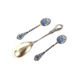 A pair of Russian silver gilt and enamel decorated spoons; and a large continental white metal