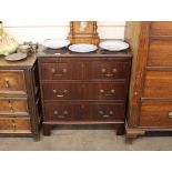 A Georgian style mahogany chest, fitted three drawers and a brushing slide, raised on bracket