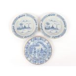 A pair of 18th Century Delft plates, decorated in the Chinese manner with river scenes, 23cm dia.;