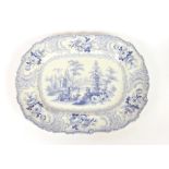 A large 19th Century blue and white transfer printed meat plate, decorated with parkland; two