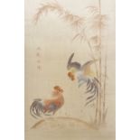 A pair of Oriental silk work embroideries, depicting fighting cockerel amongst foliage, 94cm x 58cm
