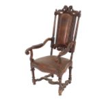 An Italian walnut Caquetoire chair, with leather upholstery, carved foliate scroll decoration to the