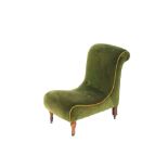 A Victorian nursing chair, of curved form, upholstered in green dralon and raised on cabriole