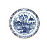 An Antique shallow Delft dish, decorated with houses, having continuous floral border, 26cm dia.