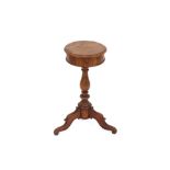 A small 19th Century circular mahogany work table, on tripod base