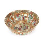 An 19th Century Canton bowl, of large proportions decorated panels of figures, foliate scrolls and
