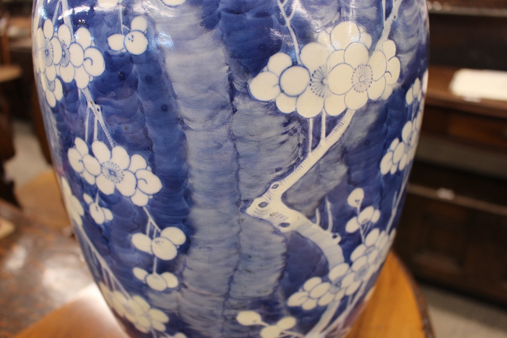 A large Chinese blue and white vase and cover, with Prunus decoration, restored, the lid  AF, 44cm - Image 5 of 8