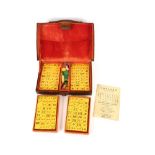 A leather cased Mah Jong set, complete with stands for the tiles