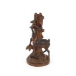 A 19th Century carved softwood Black Forest spill holder, in the form of a dead tree trunk