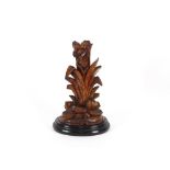 A 19th Century carved softwood Black Forest spill holder, in the form of a tree trunk flanked by