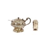 A George IV silver mustard pot, of baluster form, having hinged lid and raised foliate decoration,