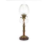 A Victorian brass table oil lamp, with cut glass reservoir and etched shade, 70cm high