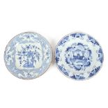 An 18th Century Delft plate, decorated with houses and flowers; and another decorated in the Chinese